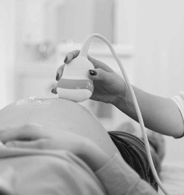 Doctor testing a pregnant woman to see what gender is inside