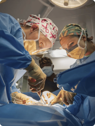 Doctors operating a pregnant woman