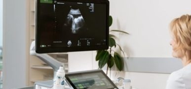 Doctor using the ultrasound device